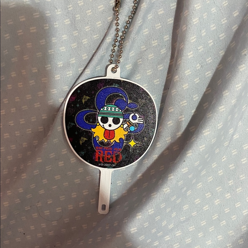 One piece fan like keychain from the movie one piece “Red”
